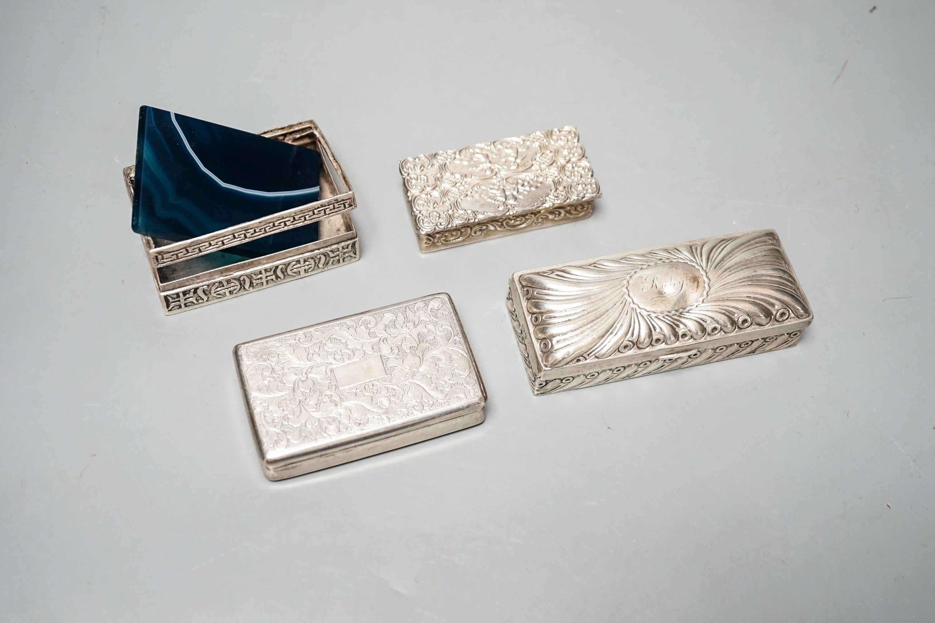 A late Victorian silver ring box, London, 1895(a.f.), 97mm, a later silver snuff box and two white metakl boxes.